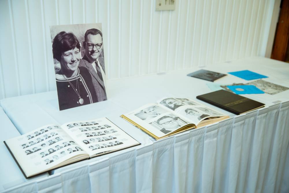 Yearbooks and photo albums from the class of '68 at the Reunion Dinner.